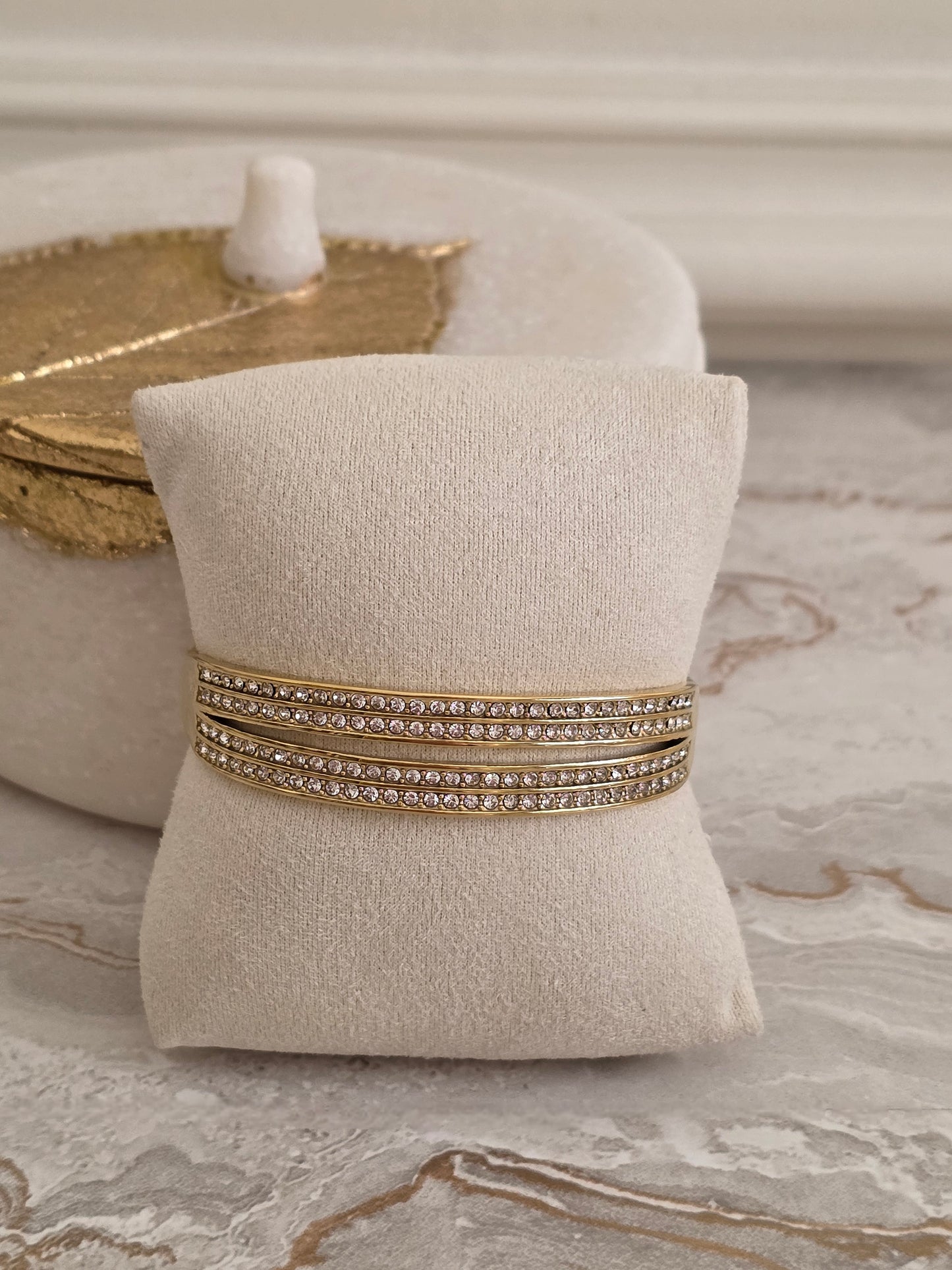 four row cubic zirconia statement bangle