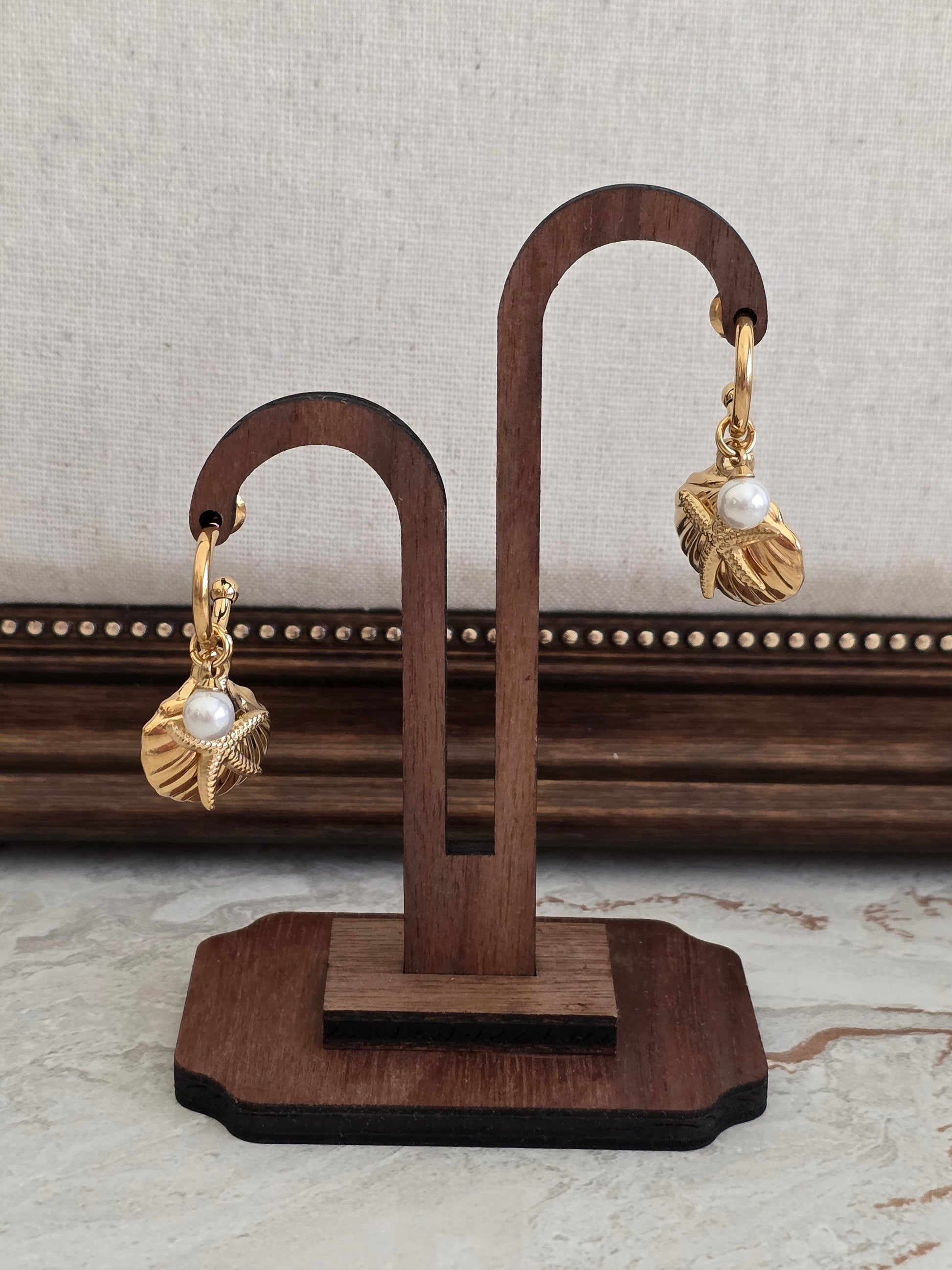 gold pearl and sea shell and starfish earrings