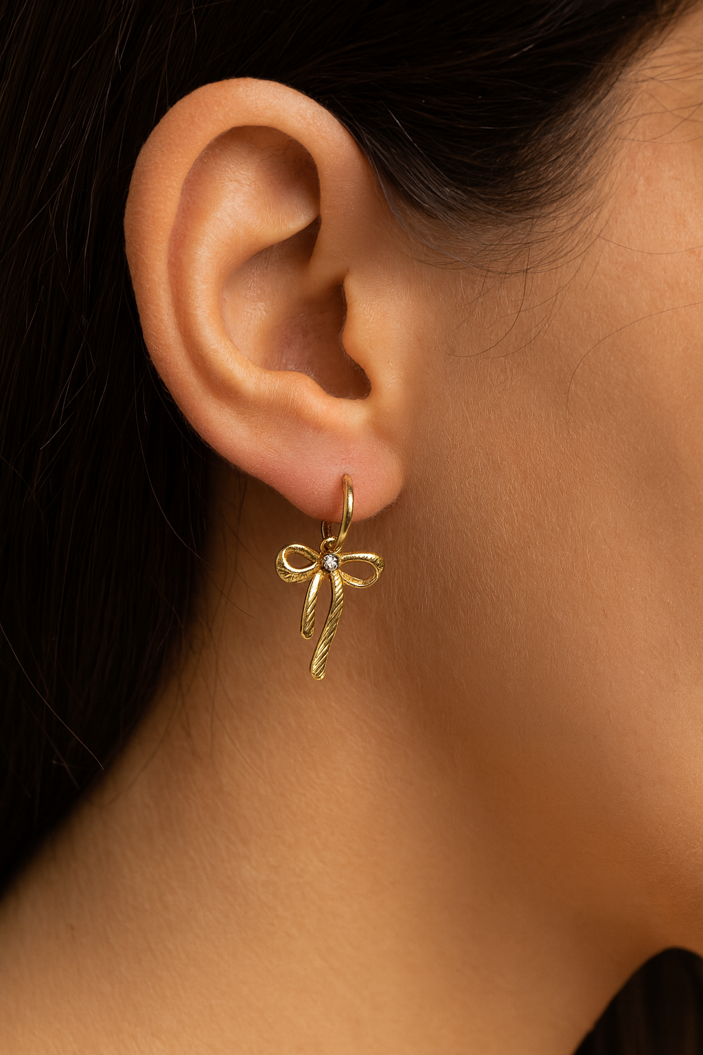 gold bow earrings with cubic zirconia