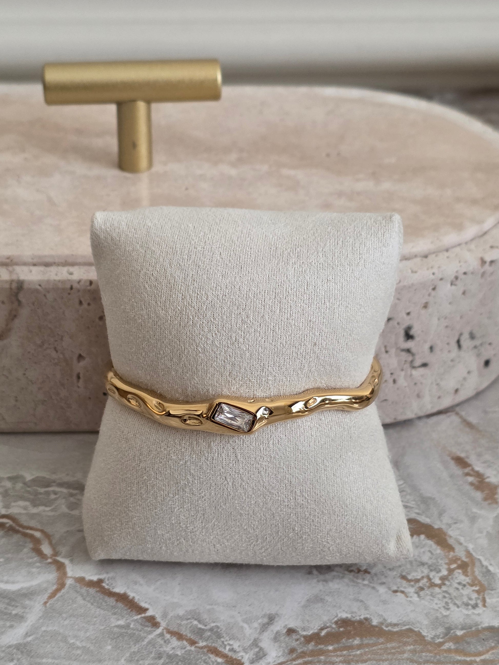 Organic Gold Cuff Bangle with a baguette cut cubic zirconia