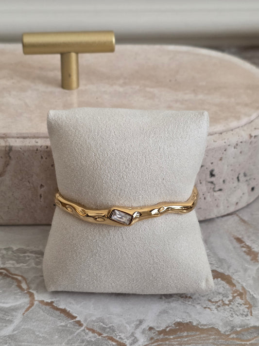Organic Gold Cuff Bangle with a baguette cut cubic zirconia