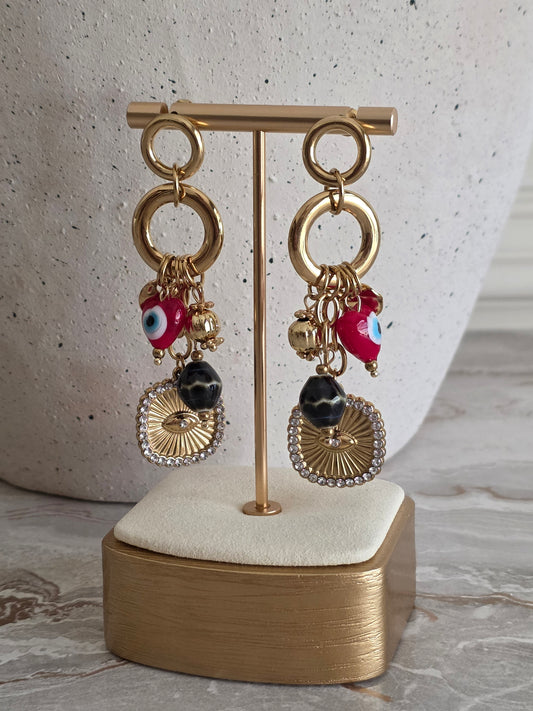 gold statement evil eye earrings