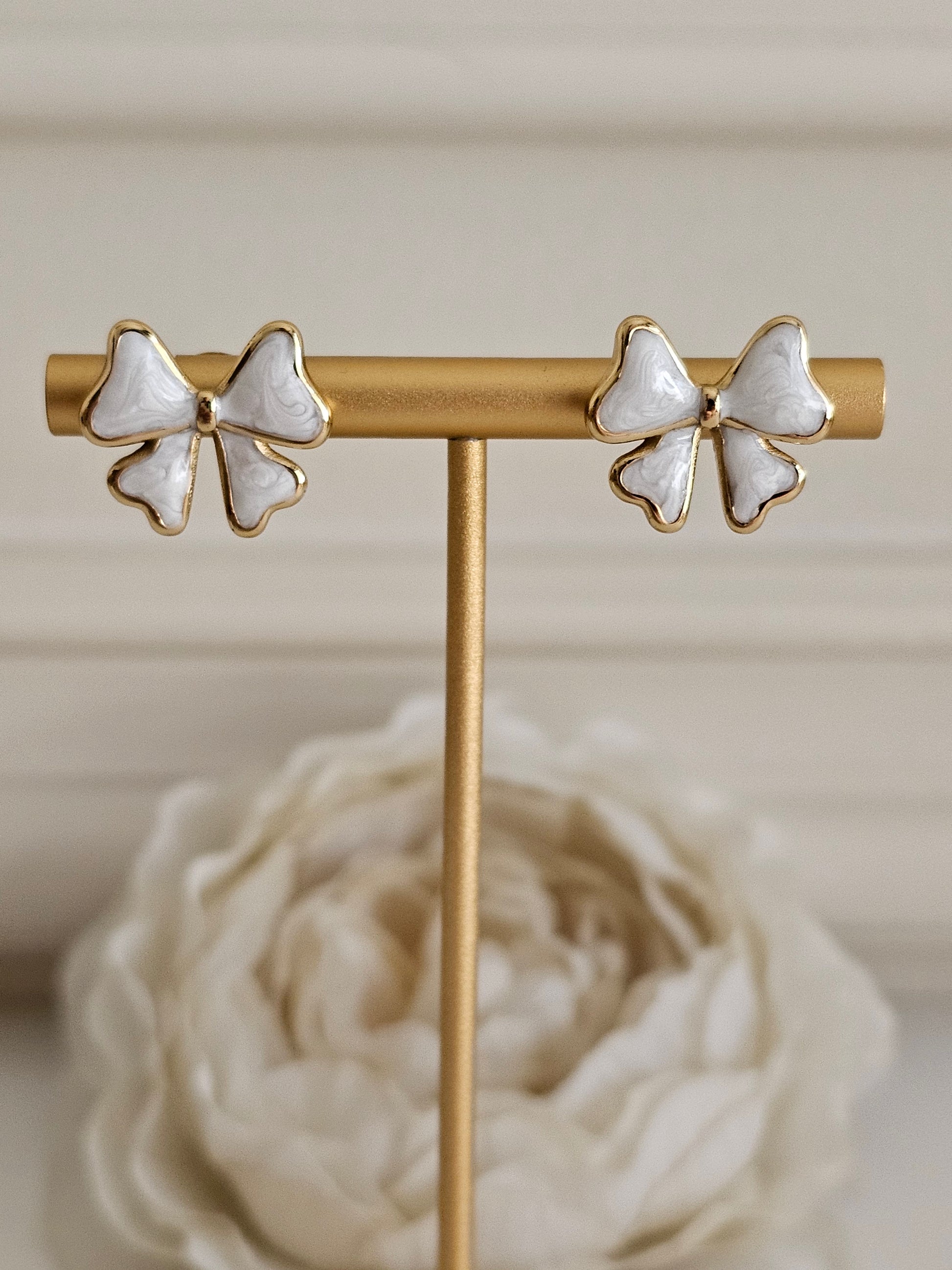White bow earrings