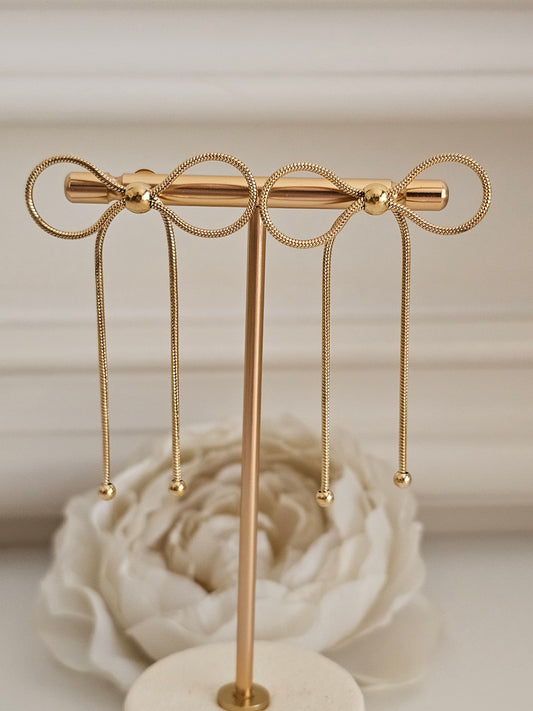 GOLD LONG BOW EARRINGS