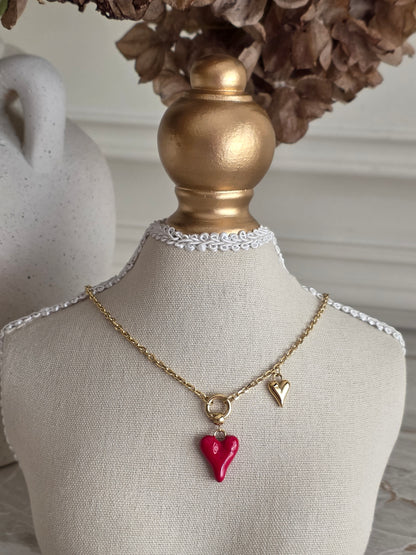 gold necklace with red enamel heart