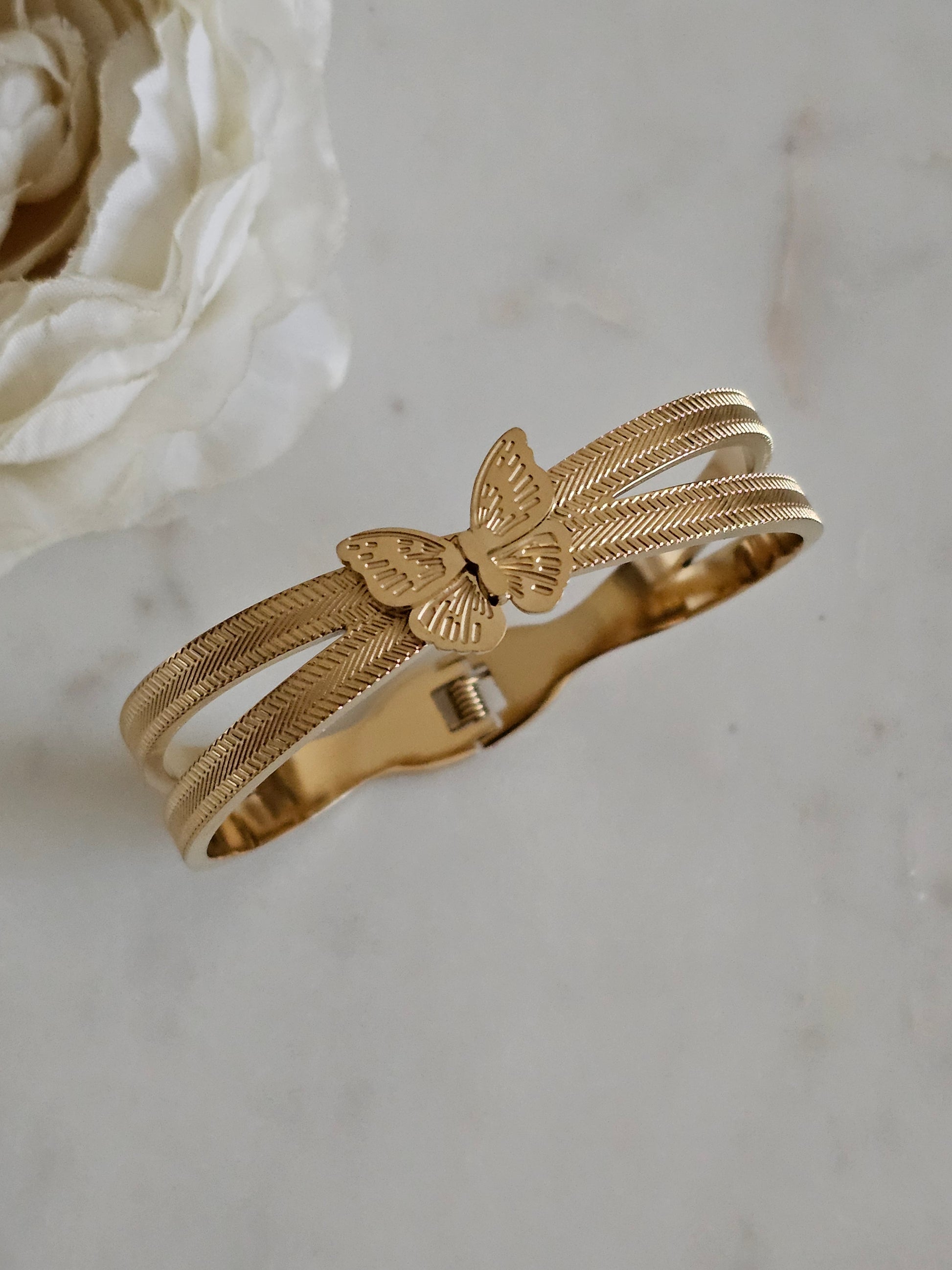 Gold plated stainless steel butterfly bangle 