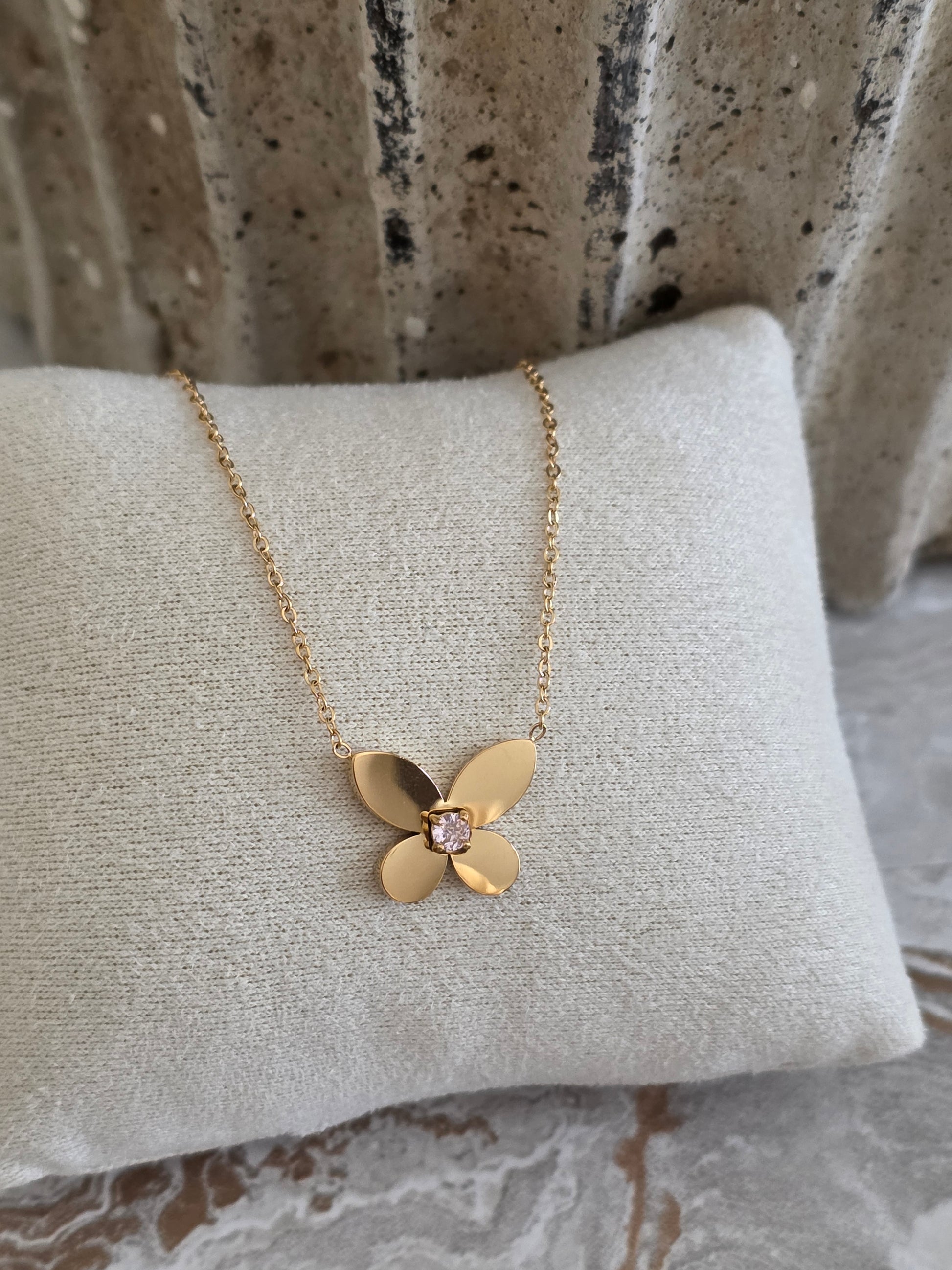 Gold butterfly necklace with pink cubic zirconia 
