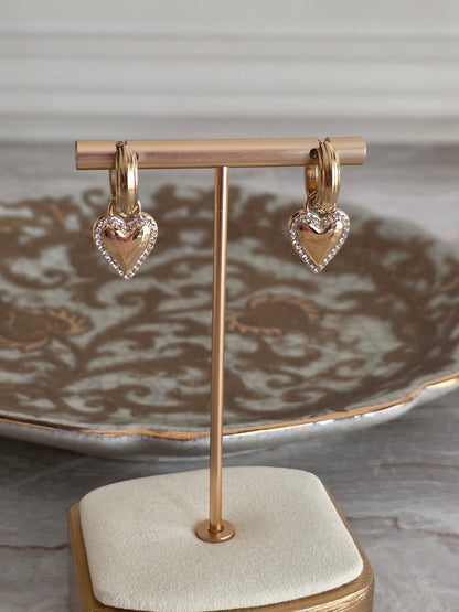 Gold hoop earrings with heart charm