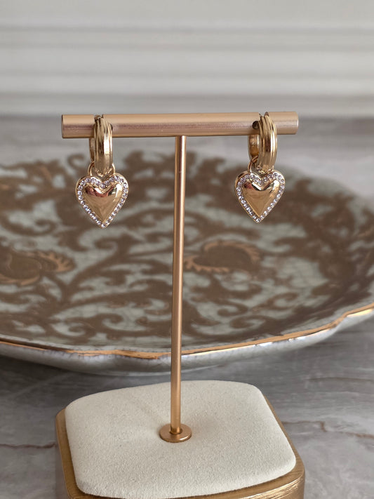 Gold hoop earrings with heart charm