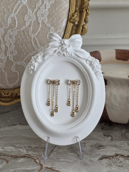 Gold bow earrings with Cubic Zirconia