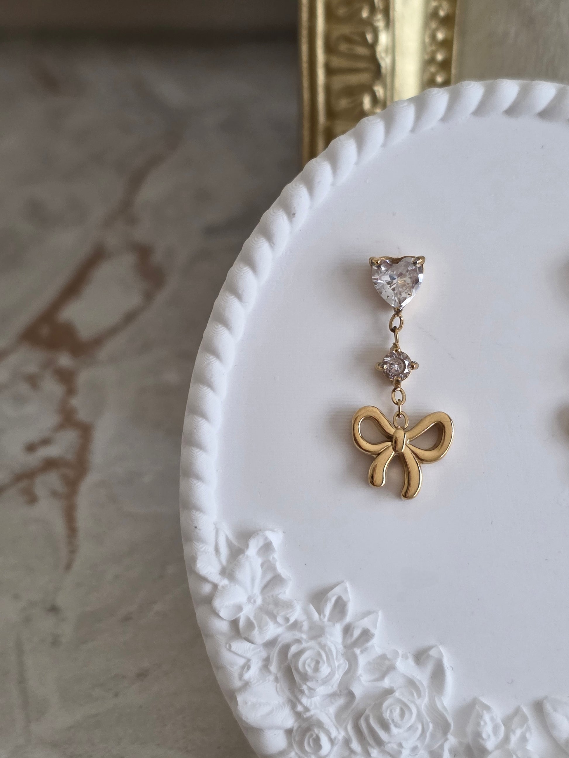 Delicate gold cubic zirconia bow earrings 