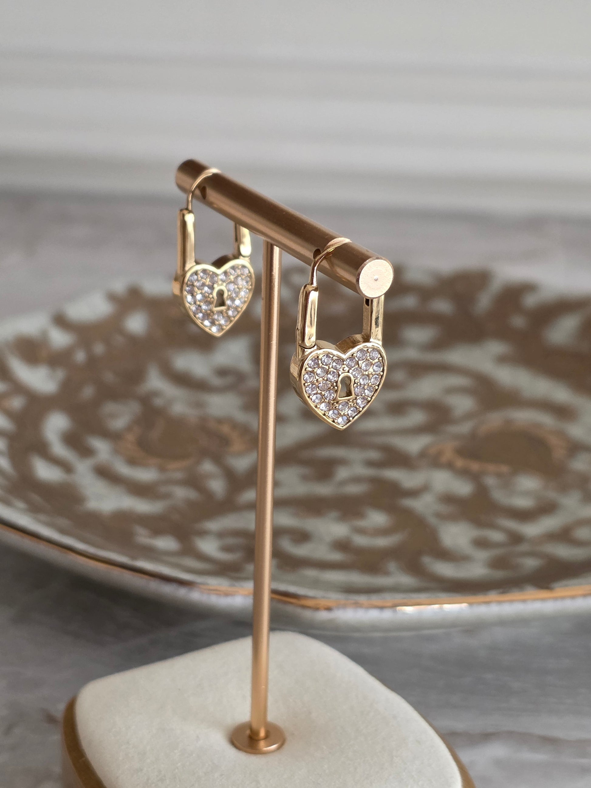 Gold heart lock earrings