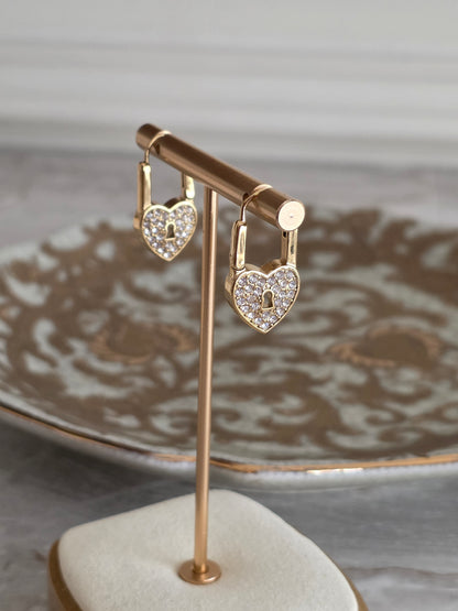 Gold heart lock earrings