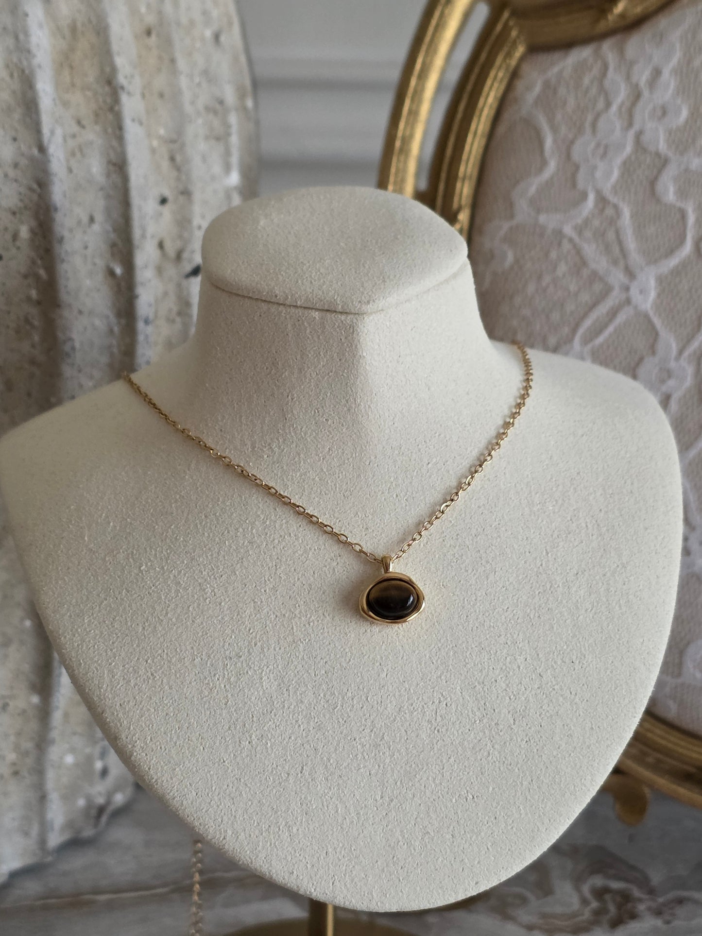 Gold necklace with tiger eye pendant