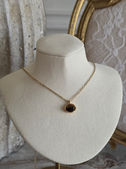Gold necklace with tiger eye pendant