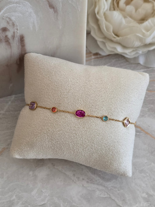 Reya Bracelet with delicate gold-toned chain and colourful multi-shaped jewel-inspired stones in pink, purple, blue and orange.
