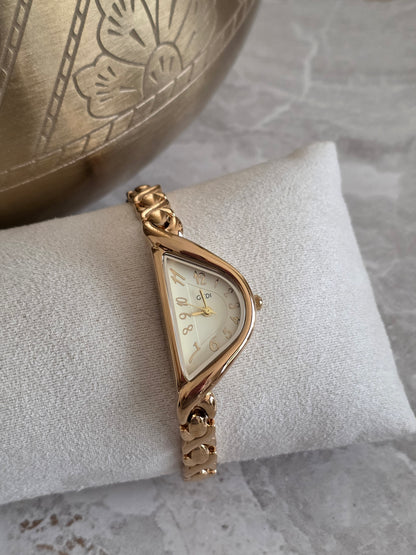 Gold Jenna Watch featuring a unique asymmetrical triangular champagne dial and sculpted gold-tone stainless steel bracelet band.