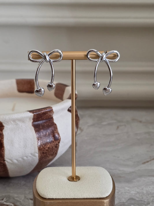 Silver statement bow earrings