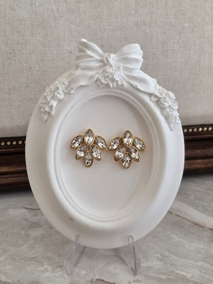 Bella Earrings featuring sparkling marquise-cut clear crystals in an elegant floral design with a polished gold-tone setting.