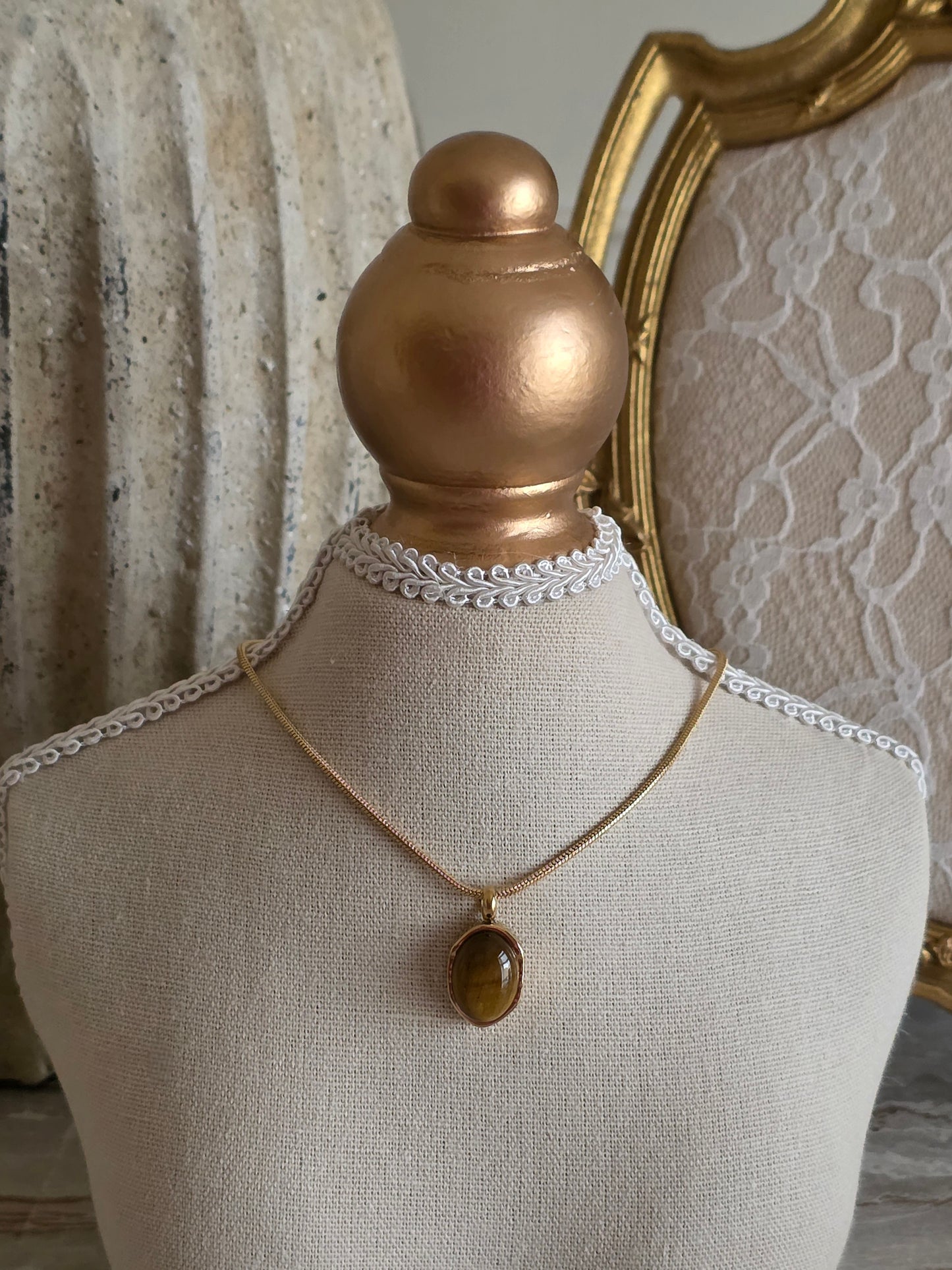 Gold snake chain necklace with tiger eye pendant