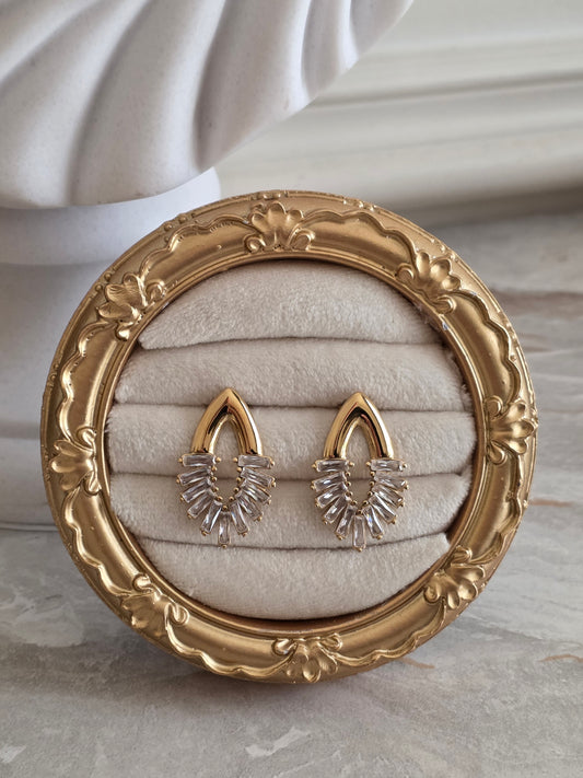 Viva Earrings featuring a gold-tone teardrop design with sparkling baguette-cut crystal detailing.