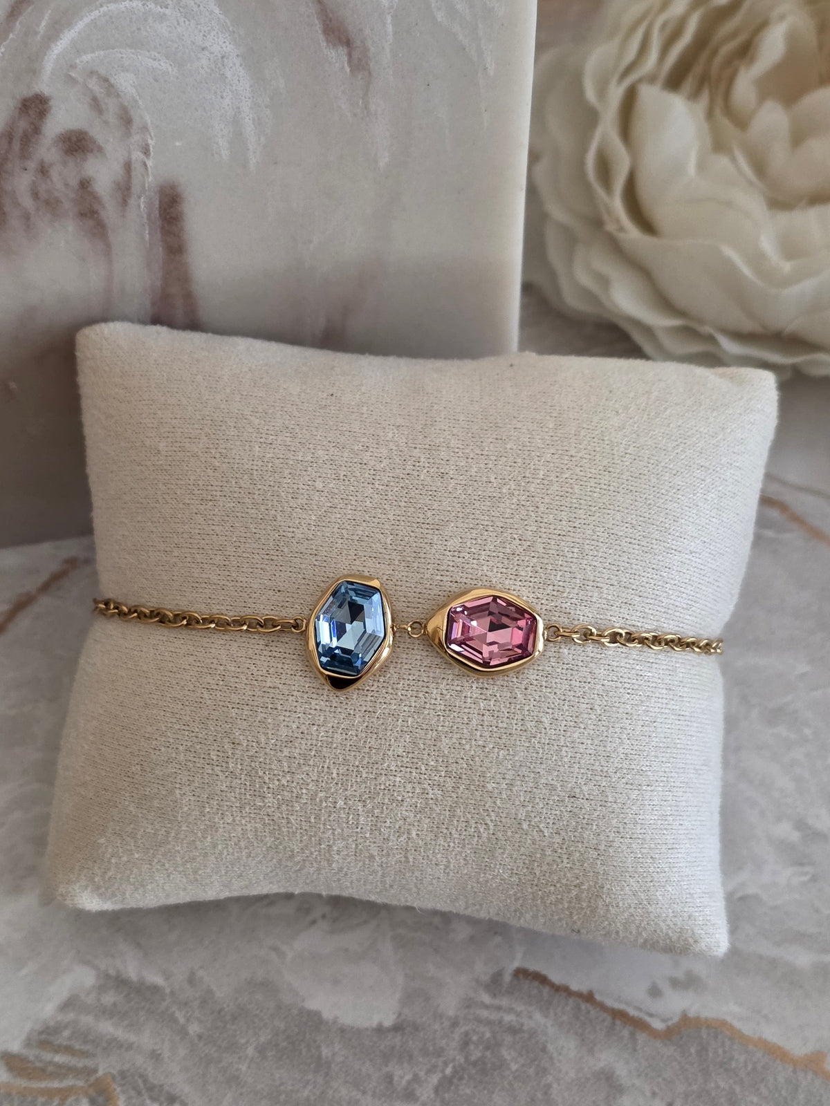Zayla Bracelet featuring blue and pink faceted stones in gold-tone settings with a delicate chain.