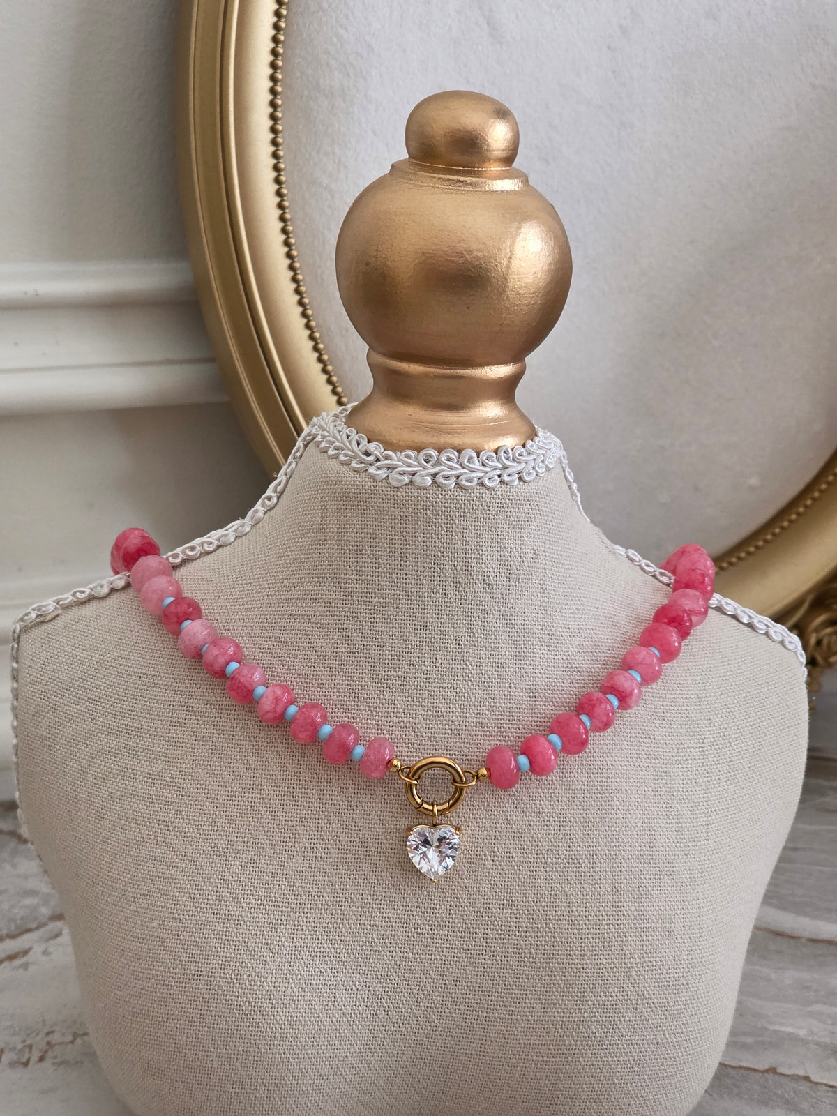 Lili Necklace with pink stone-style beads, turquoise accents, gold-tone circular clasp and sparkling heart-shaped crystal charm.