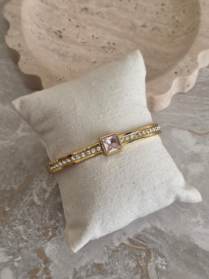 Gold bangle with pink cubic zirconia 